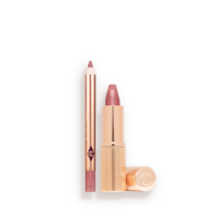 An open mini lipstick in a nude pink colour with its lid next to it and a mini lip liner pencil in a nude pink shade, with text on the banner that reads, 'Suits everyone'