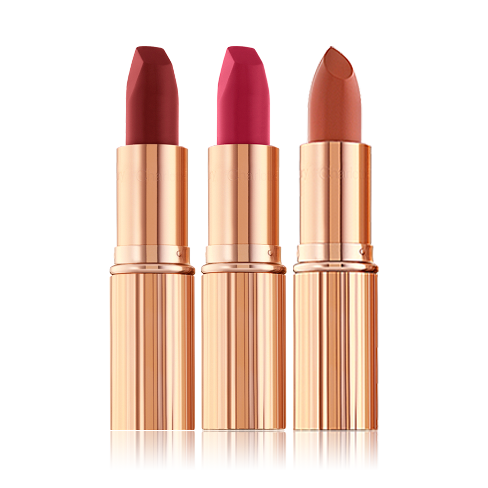 Two matte lipsticks and one satin-finish lipstick in scarlet, fuchsia, and dark terracotta. 