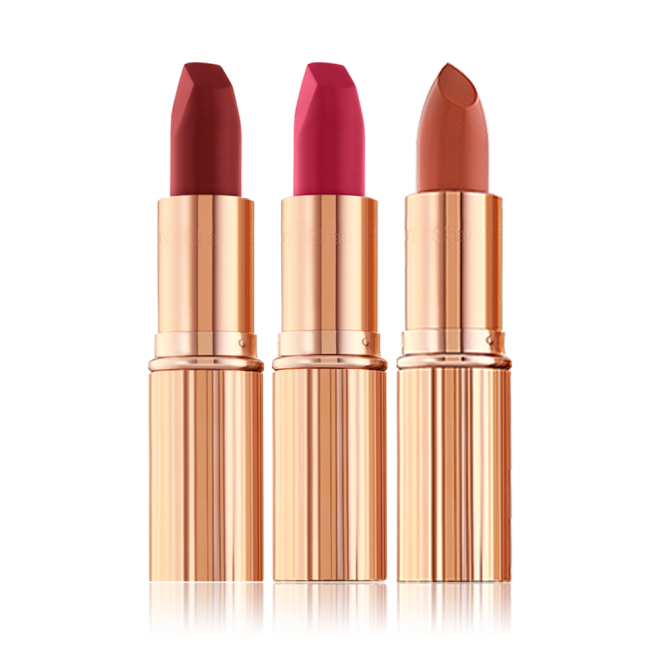 Two matte lipsticks and one satin-finish lipstick in scarlet, fuchsia, and dark terracotta. 