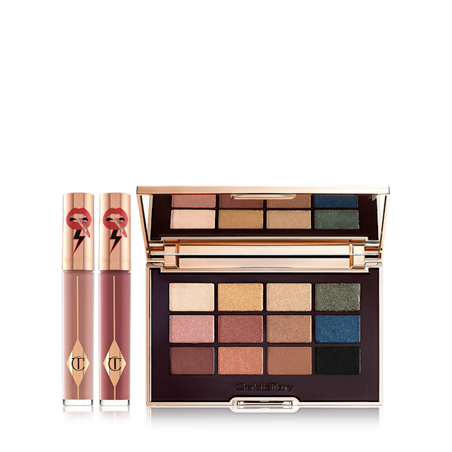 The Icon Eye Lip Duo Day Look kit displayed Two, closed liquid lipsticks in glass tubes in nude shades of brown and red with gold-coloured lids and an eyeshadow palette with matte and shimmery shades of brown, pink, green, gold, blue, and black.