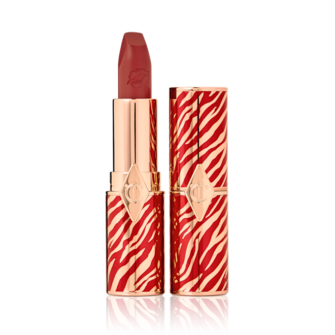 Hot Lips in Walk of a Star with and without lid Two lipsticks, one with its lid and one without, in soft, muted berry-rose colour with a matte finish.