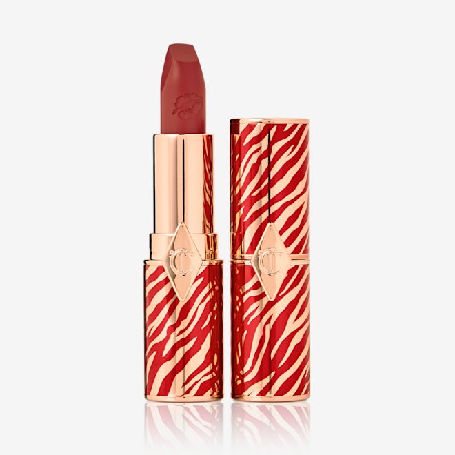 Hot Lips in Walk of a Star with and without lid Two lipsticks, one with its lid and one without, in soft, muted berry-rose colour with a matte finish.