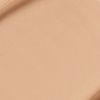 Close-up swatch of a skin-like, glowy foundation in a cool, light sandy beige shade.
