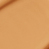 Close-up swatch of a skin-like, glowy foundation in a warm, brown-beige shade.