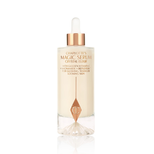 A luminous, ivory-coloured facial serum in a glass bottle with a white and gold-coloured dropper lid, 