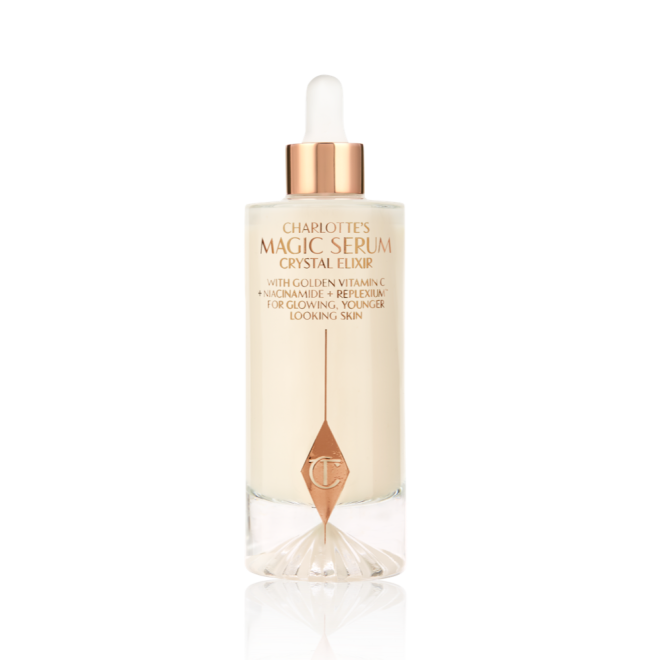 A luminous, ivory-coloured facial serum in a glass bottle with a white and gold-coloured dropper lid