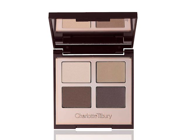 An open, mirrored-lid quad eyeshadow palette with matte eyeshadows in chocolate, taupe, tan, and cream shades 