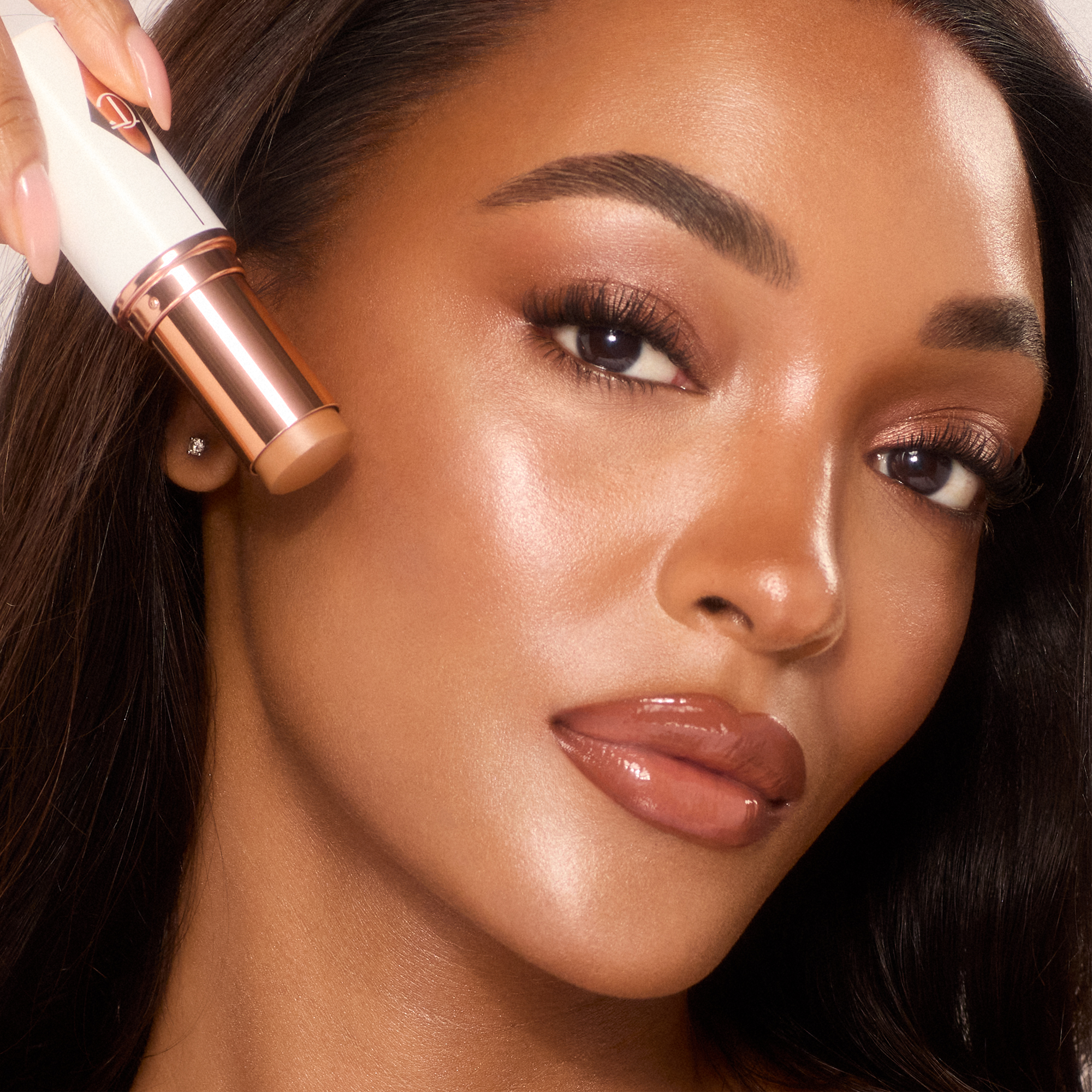 Jourdan wearing Unreal Skin Sheer Glow Tint dewy foundation stick