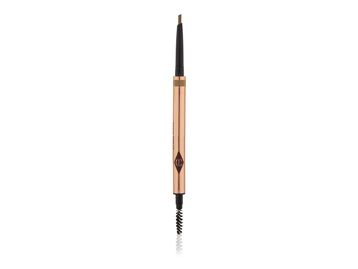 An open, double-ended eyebrow pencil and eyebrow brush in a taupe shade with gold-coloured packaging.