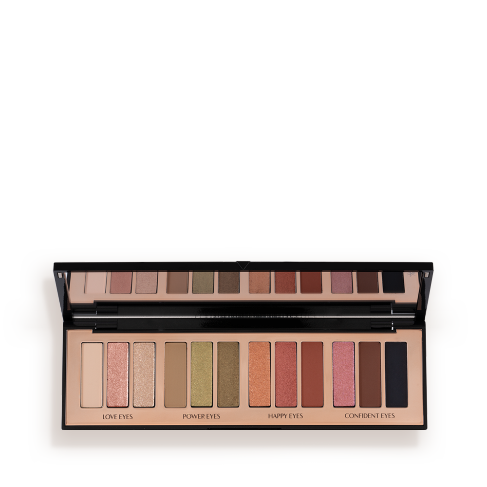 An open, 12-pan eyeshadow palette with matte and shimmery shades in beige, pink, gold, green, brown, peach, and black.