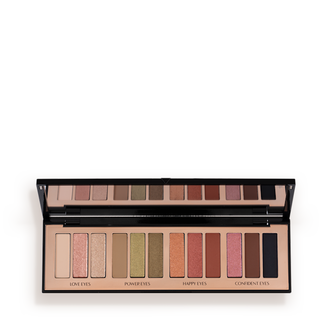 Instant Eye Palette in Smokey Eyes are Forever open An open, 12-pan eyeshadow palette with matte and shimmery shades in beige, pink, gold, green, brown, peach, and black.