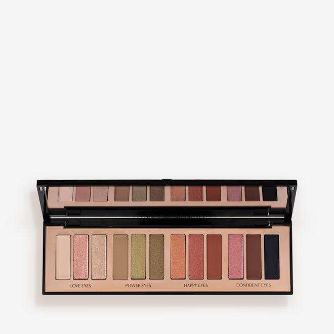 Instant Eye Palette in Smokey Eyes are Forever open An open, 12-pan eyeshadow palette with matte and shimmery shades in beige, pink, gold, green, brown, peach, and black.