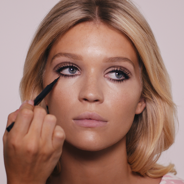 Step 7 of the 60s makeup tutorial - draw on bottom lashes with liquid eyeliner