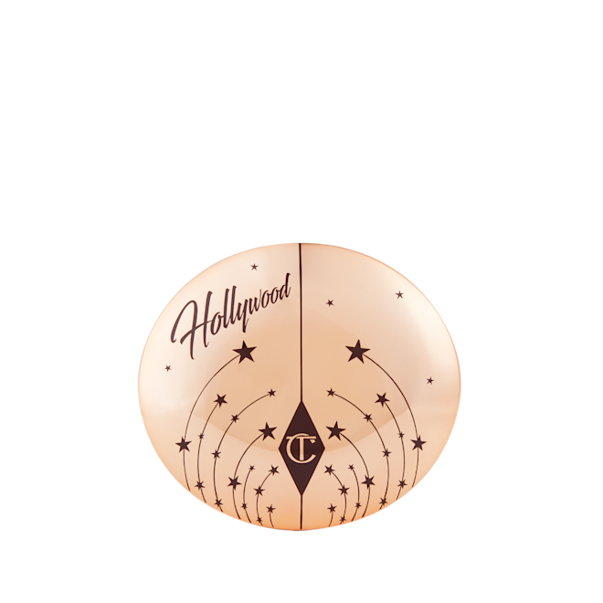 Hollywood Highlighter closed A closed highlighter compact with a gold-coloured lid, with tiny stars printed all over and Hollywood written on the top.