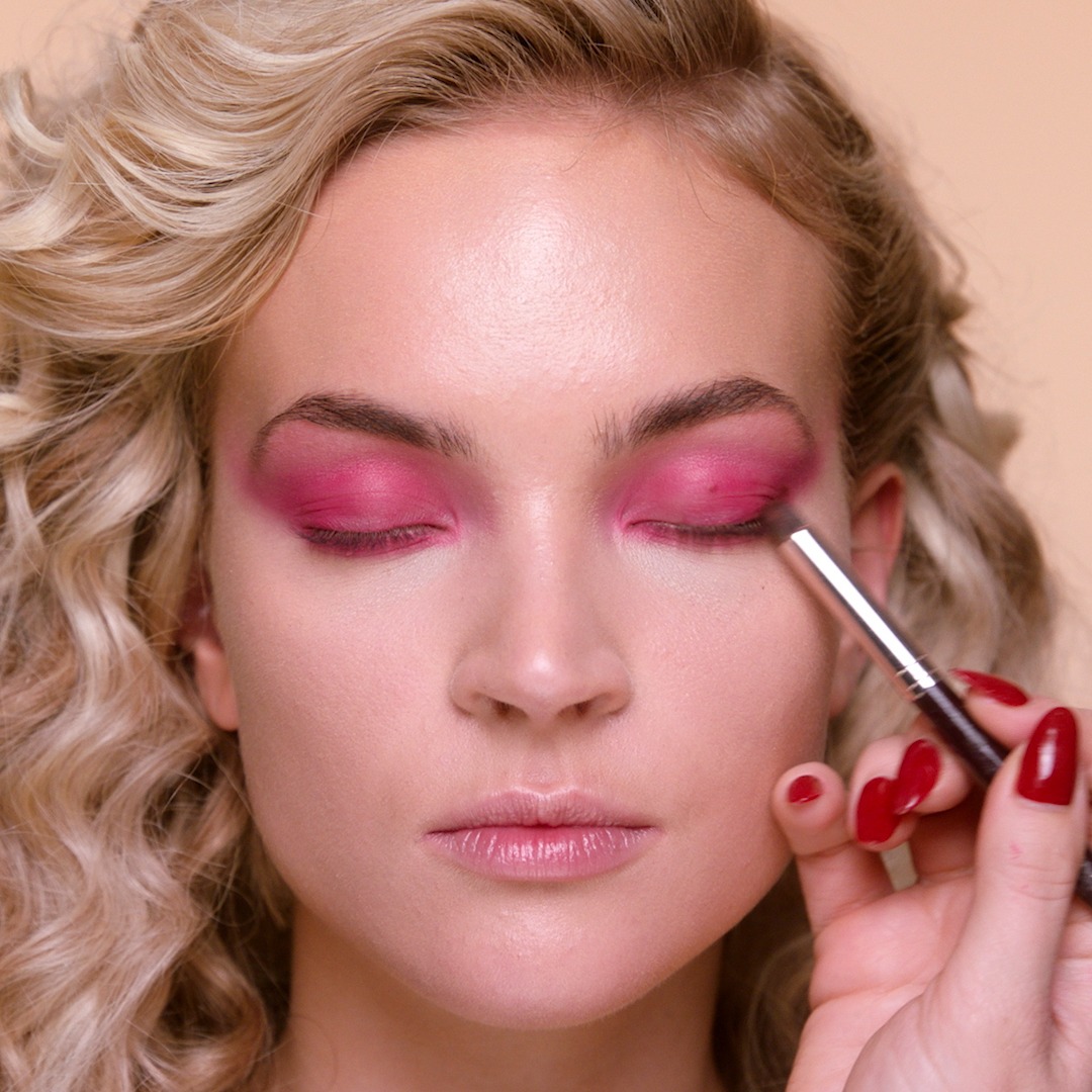 Step 5 in Sofia Tilbury's 80s Makeup Look tutorial: apply eyeshadow to the lash line