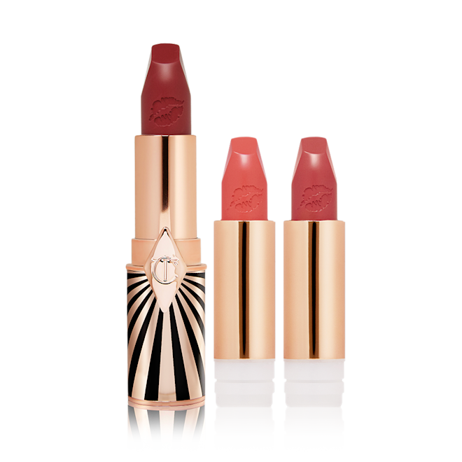 Hot Lips 2 Lucky Lip Kit open A maroon matte lipstick in a golden and red tube with a black and white print with two lipstick refills in muted red and brownish-peach,