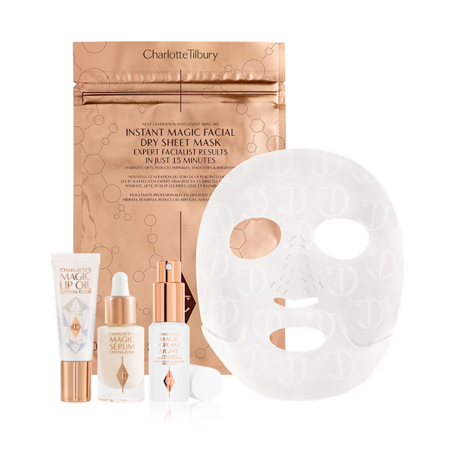 Lip oil in a white-coloured tube, travel-size luminous facial serum in a glass bottle with a dropper lid, travel-size face cream in a white bottle with a pump dispenser, and sheet mask in gold foil packaging.