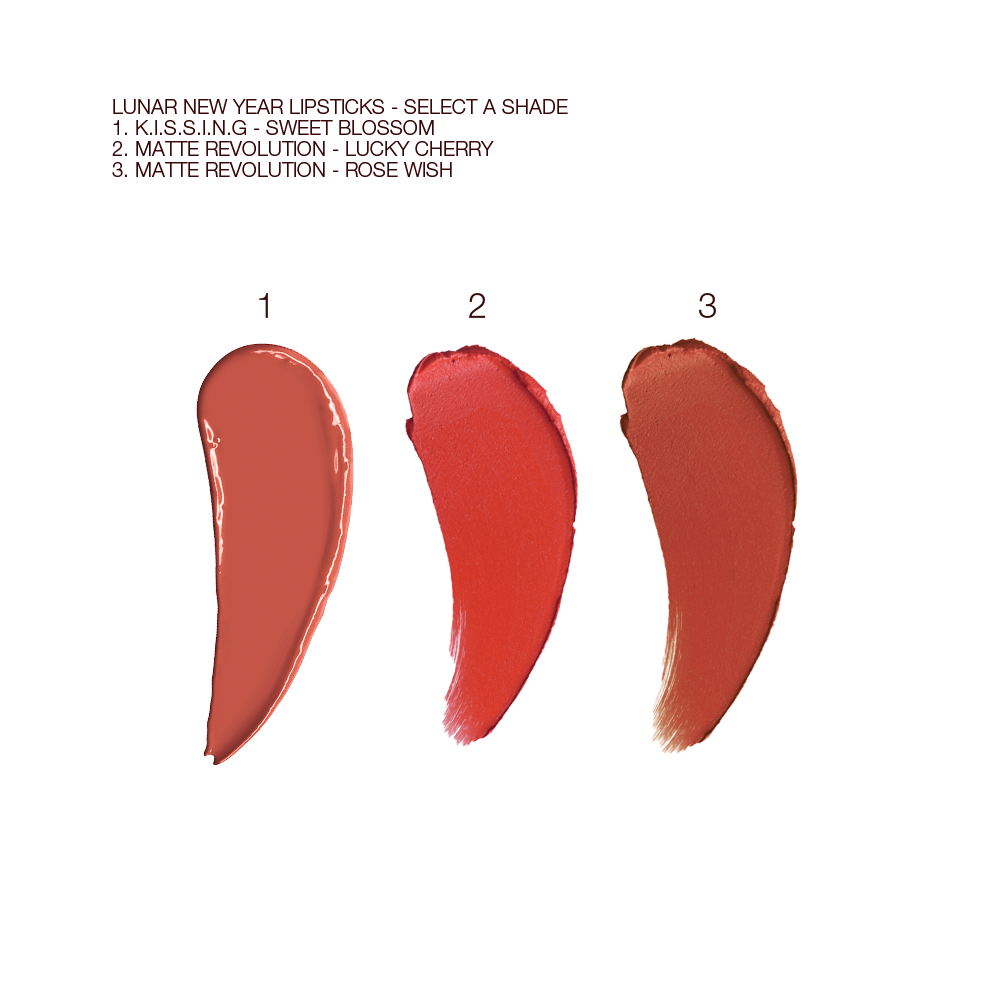 Swatches of three lipsticks in a peach-terracotta, cherry red, and brownish rose.
