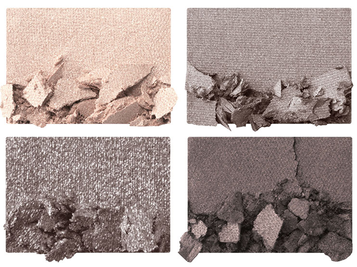 Four eyeshadow swatches in shades of grey, pearl, graphite, and silver