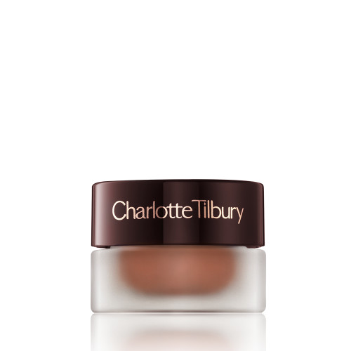 A closed glass pot with shimmery russet rose cream eyeshadow with a golden sparkle with a dark brown-coloured lid.