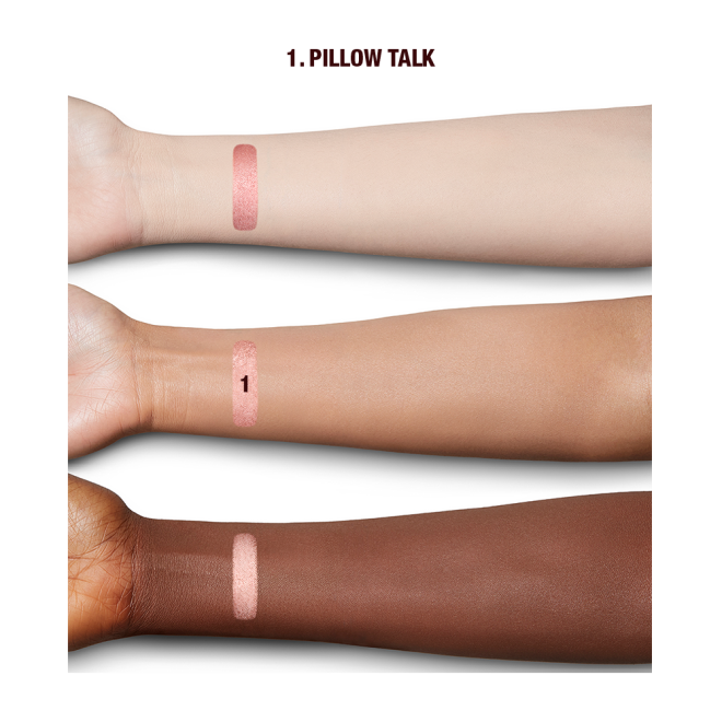 Fair, tan, and deep-tone arms with swatches of a metallic, nude pink eyeshadow.