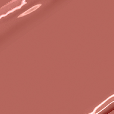 Swatch of a warm, brownish-pink nude lipstick with a satin finish.