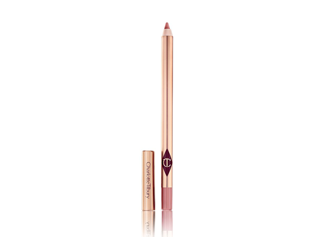 An open lip liner pencil in a nude-pink colour with the lid next to it. 