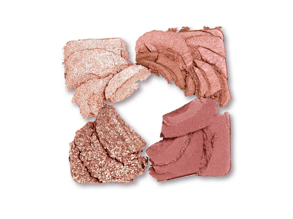 Swatches of four shimmery and matte eyeshadows in shades of cream, pink, gold, and red clay. 