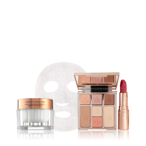 Thick, pearly-white face cream in a glass jar with a gold-coloured lid, textured sheet mask, face palette with three eyeshadows, two blushes, and contour shades, and an open lipstick in a berry-rose shade. 