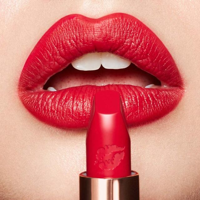 Model with blonde hair wearing Patsy Red Hot Lips lipstick
