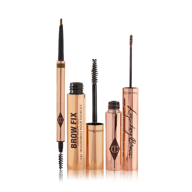 An open, double-ended eyebrow pen and brush, open eyebrow gel, and open eyebrow tint, all in gold-coloured tubes.