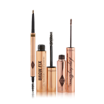 An open, double-ended eyebrow pen and brush, open eyebrow gel, and open eyebrow tint, all in gold-coloured tubes.