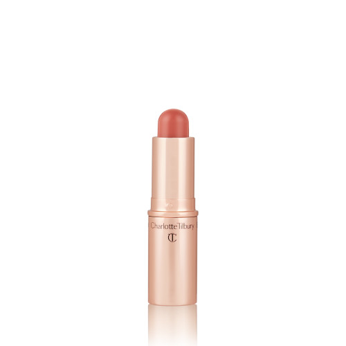 An open, lip and cheek colour stick in a glowy nude rose shade in a golden-coloured tube.