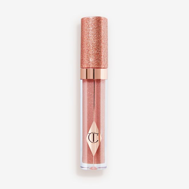 Jewel Lips in Opal Magic closed A shimmery lip gloss in a rosy opal shade with fine glitter with a glittery lid.