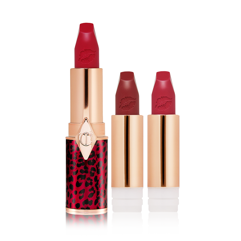 A true red matte lipstick in a golden and red tube with a leopard print with two lipstick refills in berry-rose and brownish plum. 