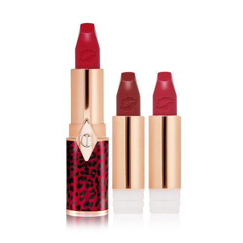 A true red matte lipstick in a golden and red tube with a leopard print with two lipstick refills in berry-rose and brownish plum. 