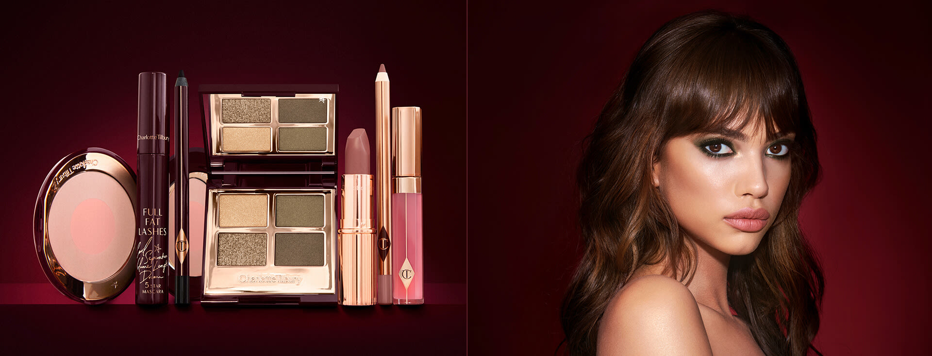 A medium-tone model with brown eyes wearing smokey green eye makeup with black eyeliner, soft brown blush, and nude brown lipstick, along with a quad eyeshadow palette in shades of green and gold, a brown eyeliner pencil, mascara, an open two-tone blush in nude pink, a warm pink lip liner pencil, a warm rose lipstick, and a bright pink lip gloss. 