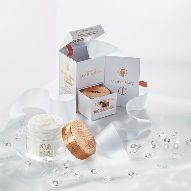 Magic Creams Triology with refills A collection of boxes with full-size face and eye creams in elegant glass jars with gold-coloured lids along with their refills.
