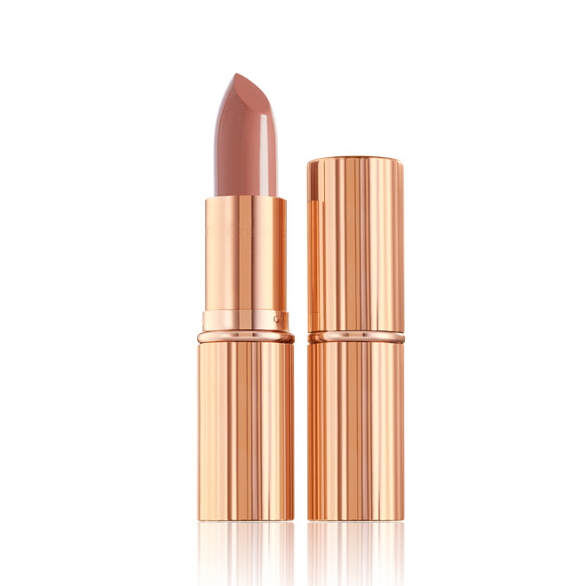 two lipsticks, with and without lid, in soft rosy peach shade with a satin finish in sleek gold-coloured packaging.