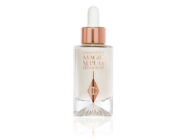 An open luminous, ivory-coloured serum in an opened glass bottle.