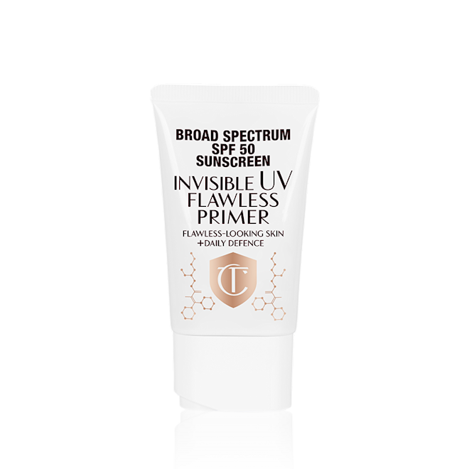 PRIMER US A primer in a white-coloured tube with a white-coloured lid with text on it that reads, 'invisible UV Flawless poreless primer SPF 50 PA++++'.