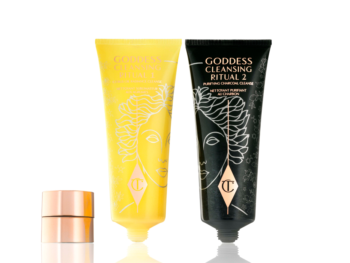 Two facial cleansers, one in lemon-yellow packaging and the other in charcoal-black, with rose-gold coloured lids. 