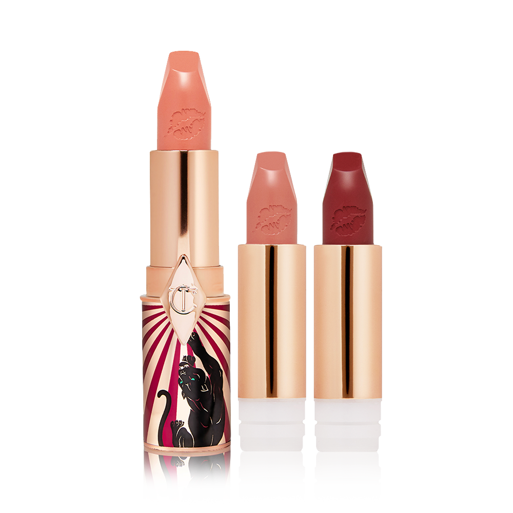 A full-size soft peach satin-finish lipstick in a golden and red tube with a jaguar printed on it with two lipstick refills in nude peach and dark crimson,