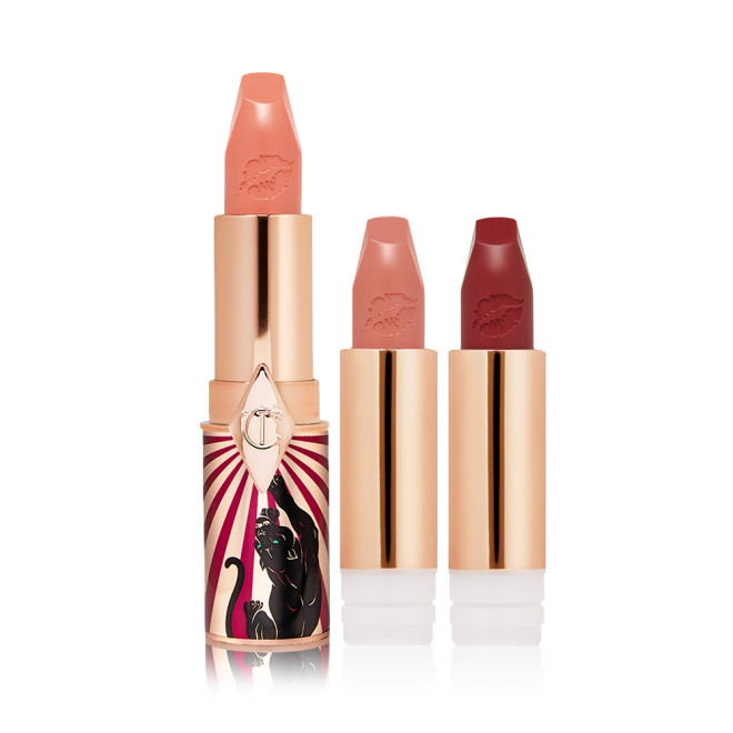 A full-size soft peach satin-finish lipstick in a golden and red tube with a jaguar printed on it with two lipstick refills in nude peach and dark crimson,