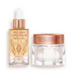 A light-gold-coloured facial oil in a glass bottle with a gold and white-coloured dropper lid with a white and gold-coloured dropper lid and pearly-white face cream in a glass jar with a gold-coloured lid. 