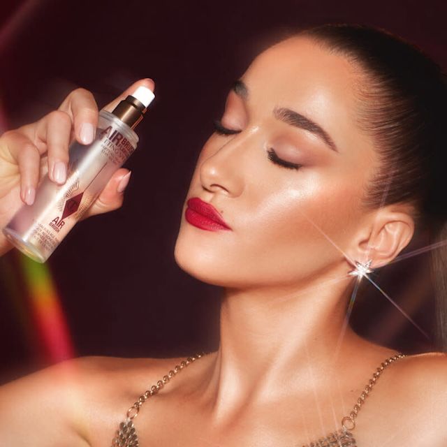 Bella Tilbury setting makeup with setting spray