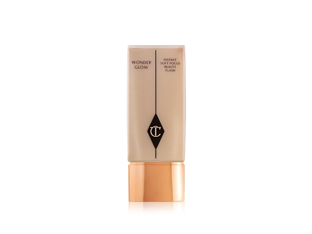A medium-tone face primer with the CT logo printed on it with a golden-coloured, metallic lid. 