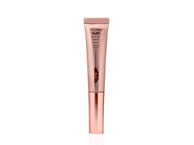A liquid highlighter-blusher wand in shiny, nude-pink packaging with a rose-gold-coloured lid. 