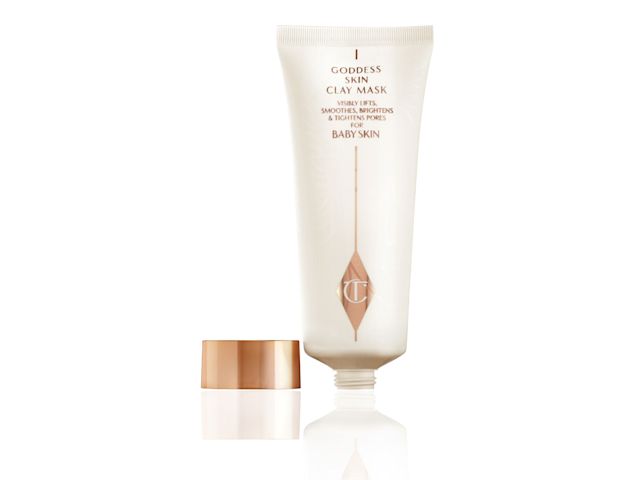 An open clay mask in white and rose gold tube with a rose-gold metallic lid. 