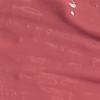 Close-up swatch of a moisturising lipstick balm in a nude pink colour.
